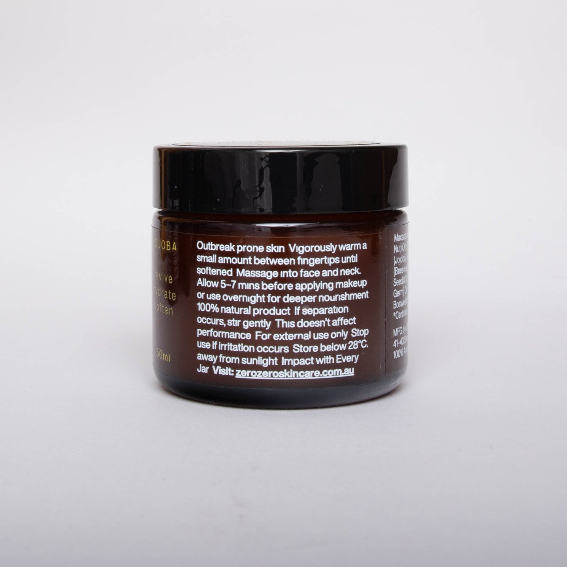 Amber glass cosmetics jar with black lead and white writing with instructions on how to use.