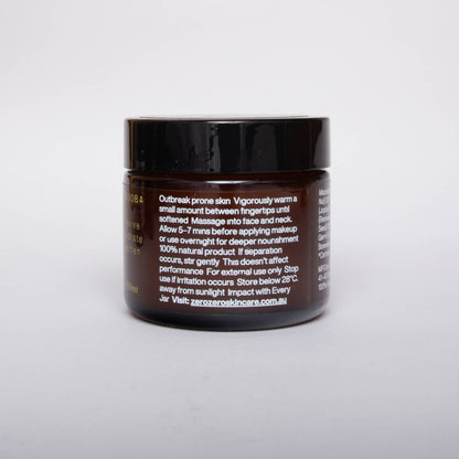 Amber glass cosmetics jar with black lead and white writing with instructions on how to use.